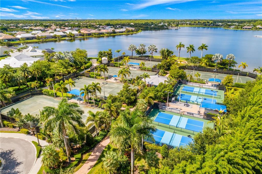 14852 Dockside Lane Naples, FL 34114 - Photo 46 of 49 a view of a lake with a city