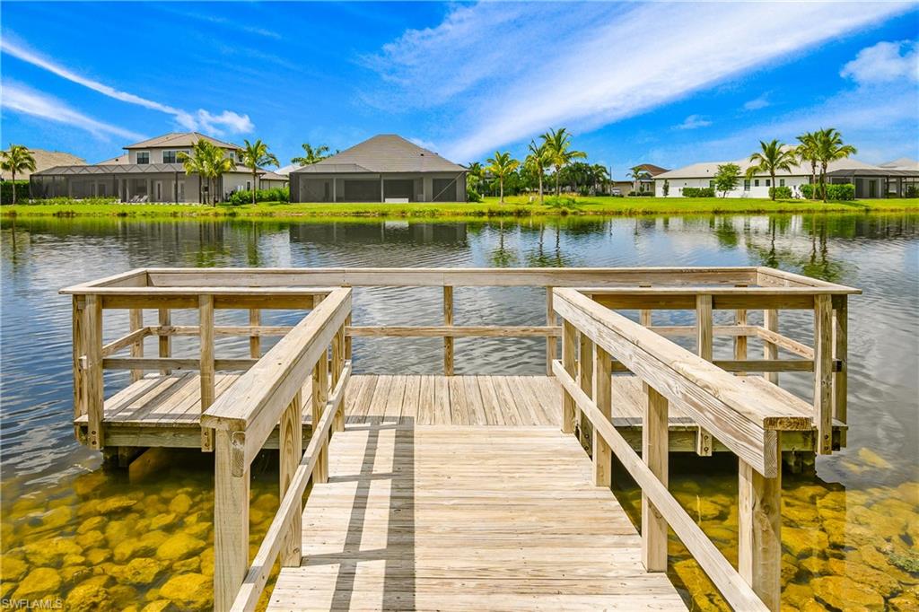14852 Dockside Lane Naples, FL 34114 - Photo 48 of 49 a view of a lake with sitting area and furniture