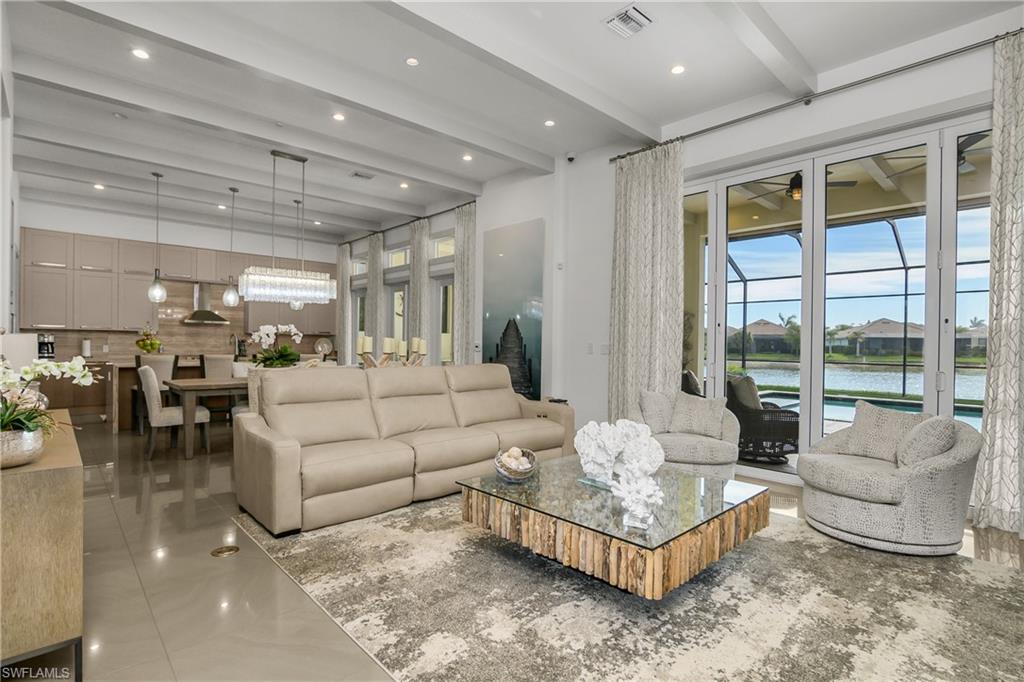 14852 Dockside Lane Naples, FL 34114 - Photo 10 of 49 a living room with furniture and a large window