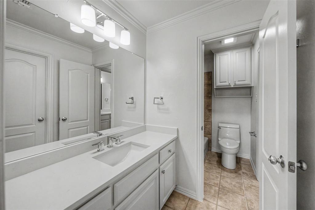 1200 Mount Gilead Road Keller, TX 76262 - Photo 29 of 38 a bathroom with a sink a toilet and shower