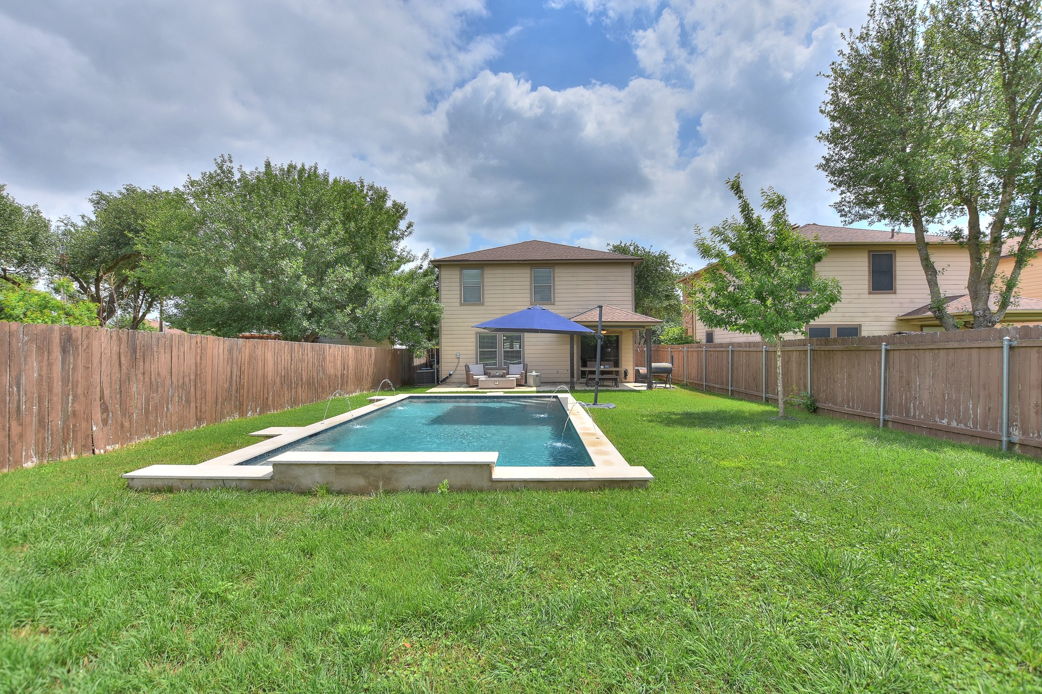 74 Jan Lane Georgetown, TX 78626 - Photo 12 of 31 a view of backyard with a barn and large trees