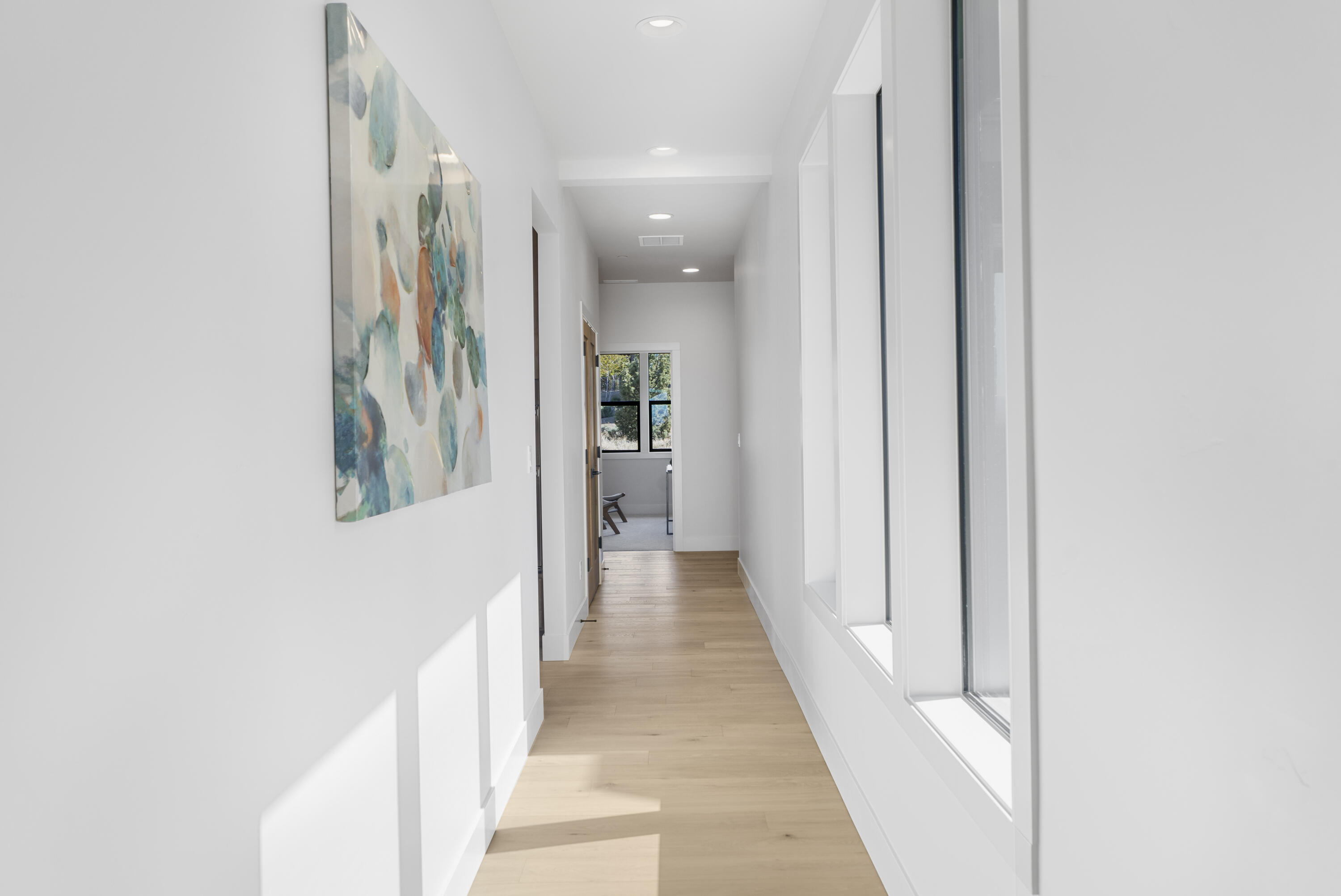 16883 Southwest Paragon Court Powell Butte, OR 97753 - Photo 10 of 42 Light pours in the hallways of this home offering walls for galleries and smooth paths of traffic