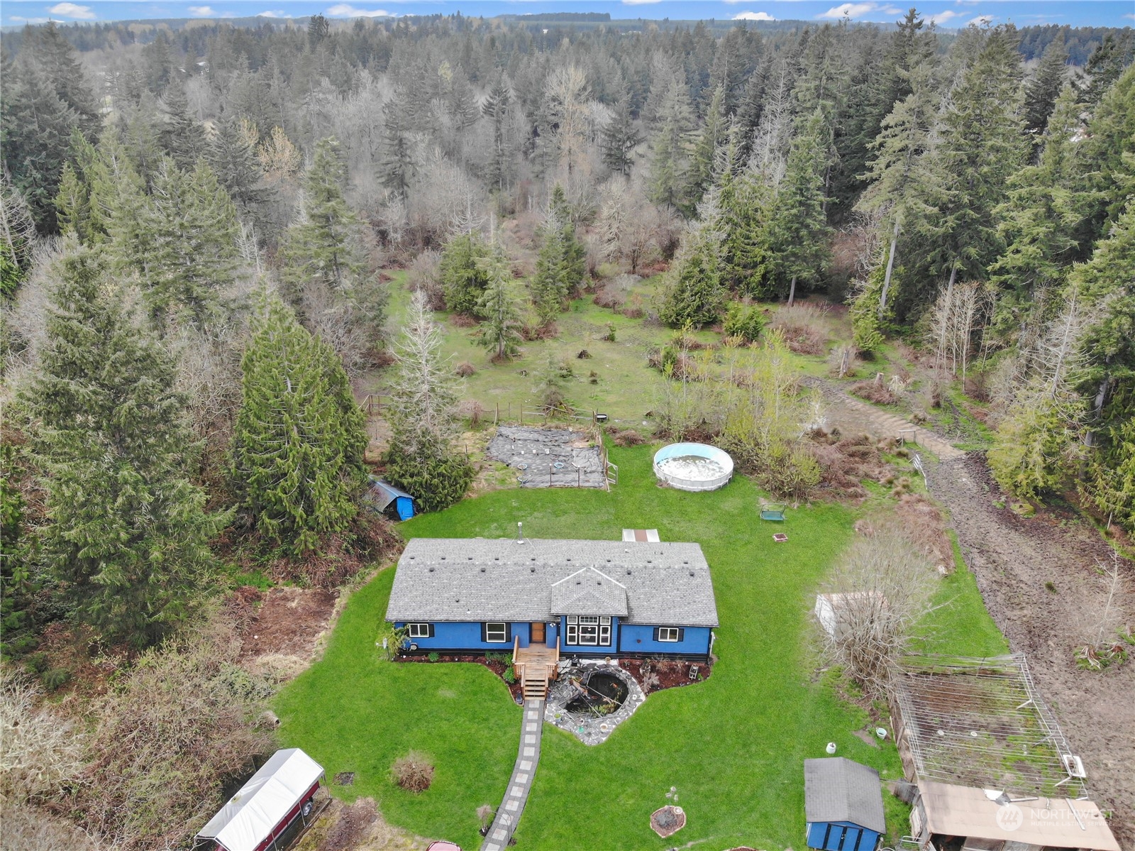 aerial view of a house with a yard