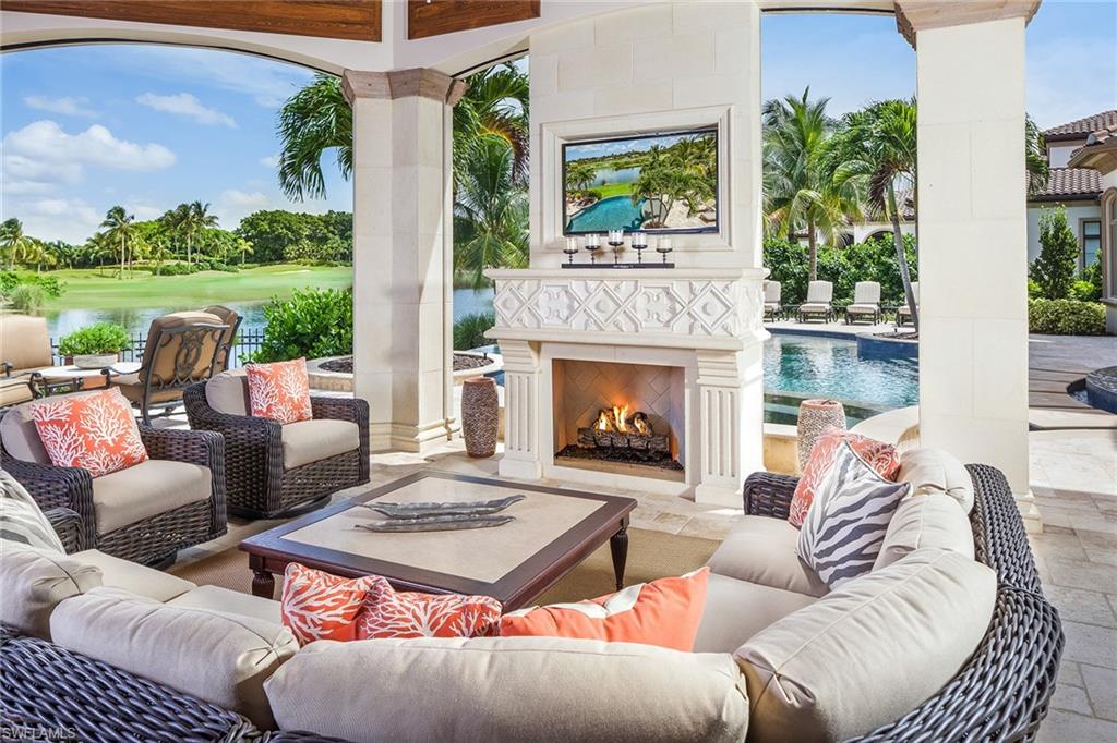 a outdoor living space with furniture and a fireplace