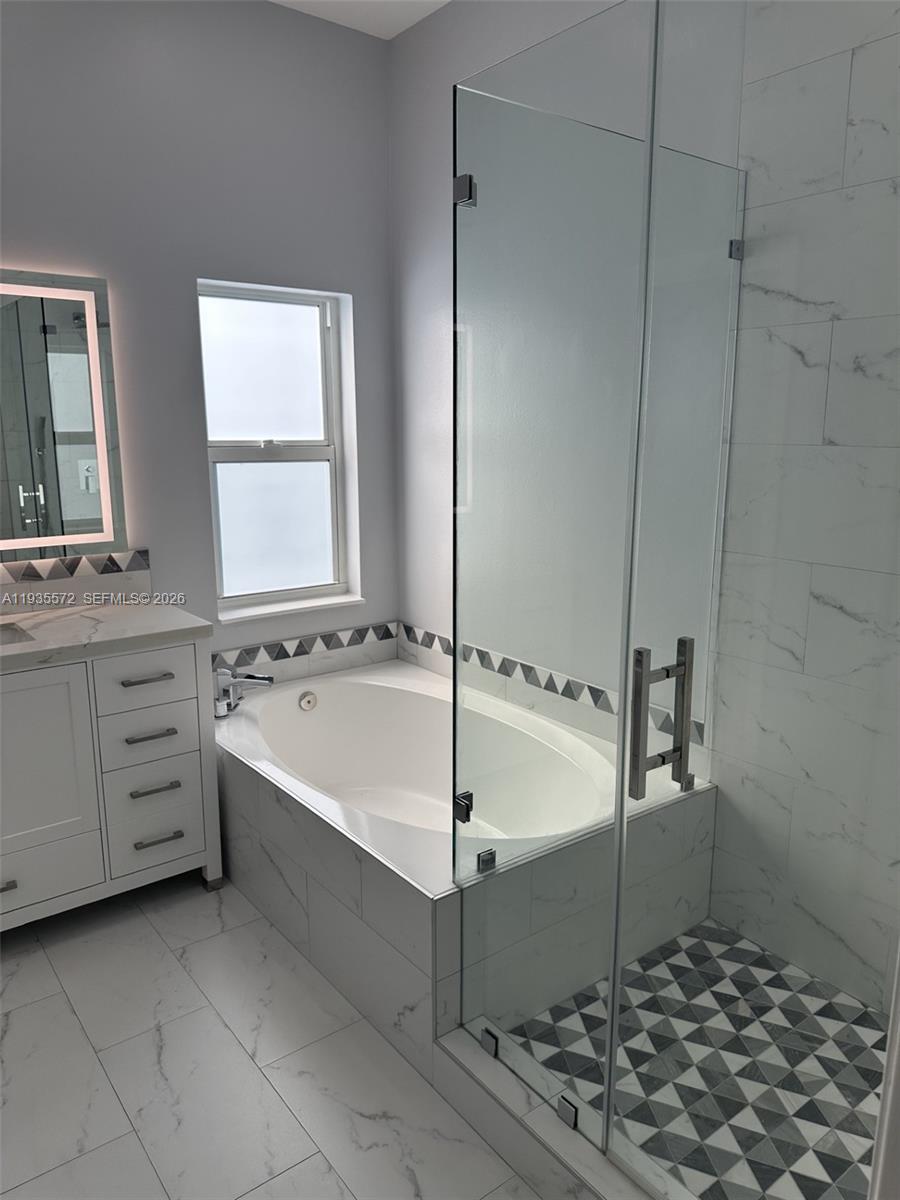 The Ridges Weston, FL 33331 - Photo 13 of 28 a bathroom with a bathtub and a sink