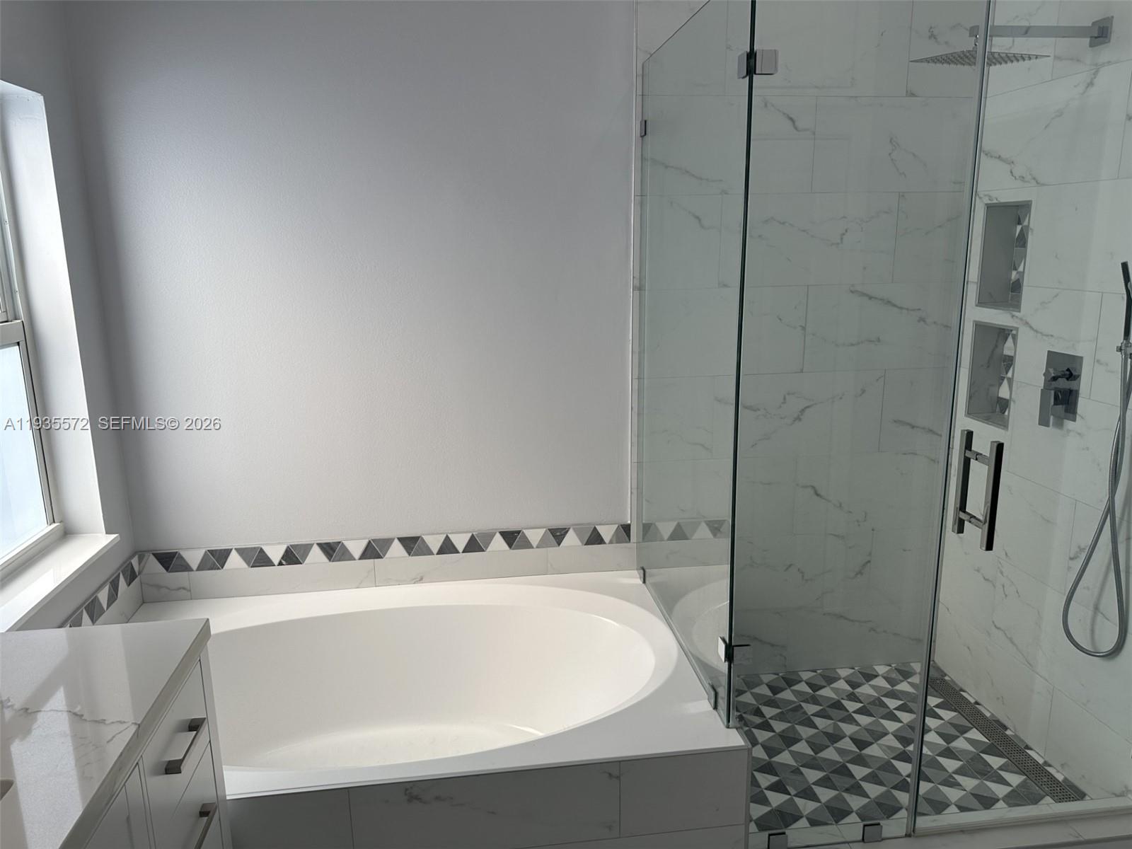 The Ridges Weston, FL 33331 - Photo 16 of 28 a bathroom with a bathtub and shower