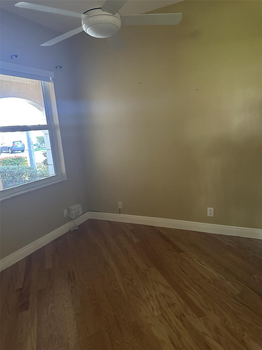The Ridges Weston, FL 33331 - Photo 20 of 28 an empty room with wooden floor and windows