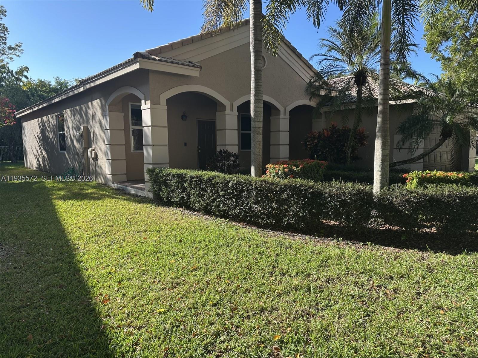 The Ridges Weston, FL 33331 - Photo 2 of 28 a front view of a house with garden