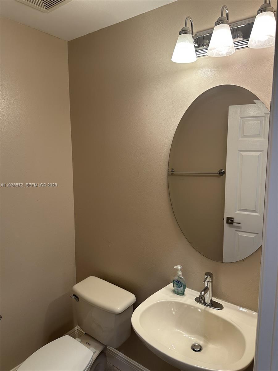 The Ridges Weston, FL 33331 - Photo 22 of 28 a bathroom with a sink and a mirror