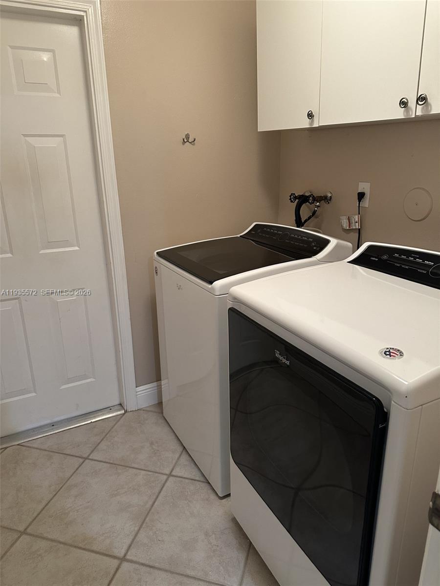 The Ridges Weston, FL 33331 - Photo 23 of 28 a utility room with dryer and washer