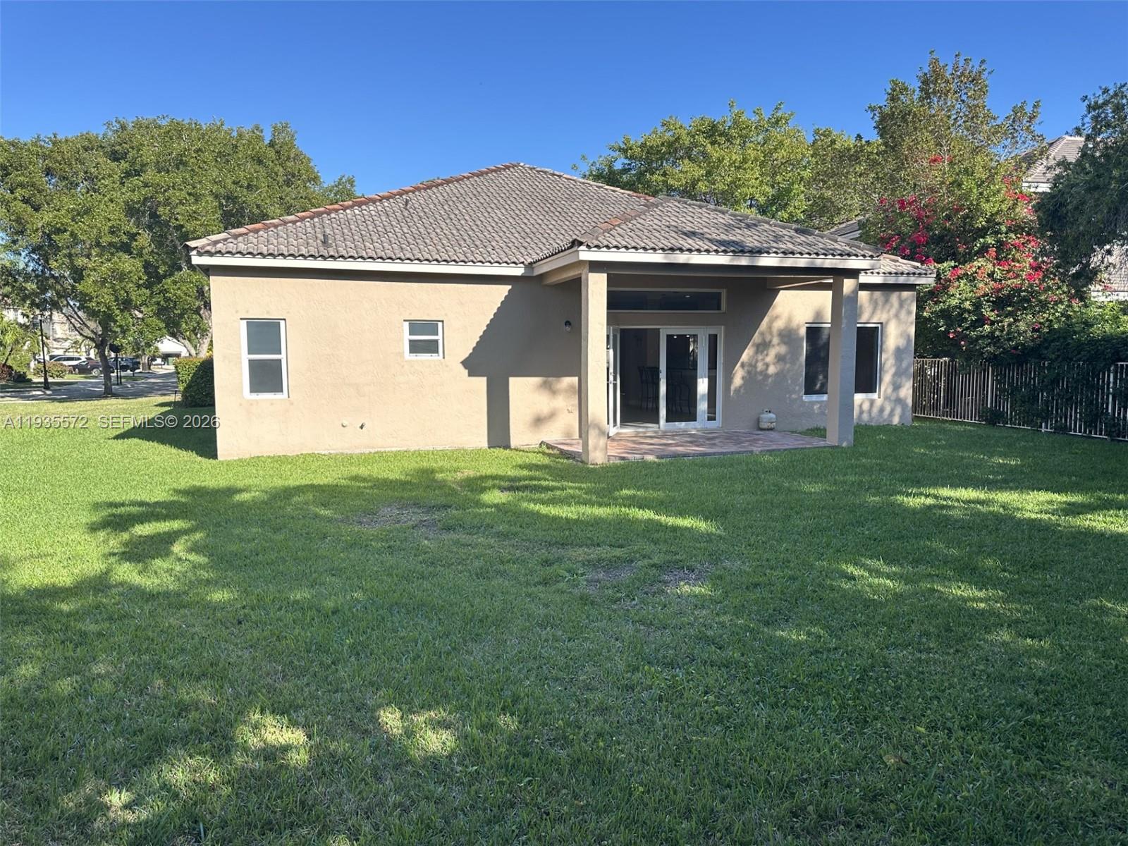 The Ridges Weston, FL 33331 - Photo 26 of 28 a front view of house with yard and green space