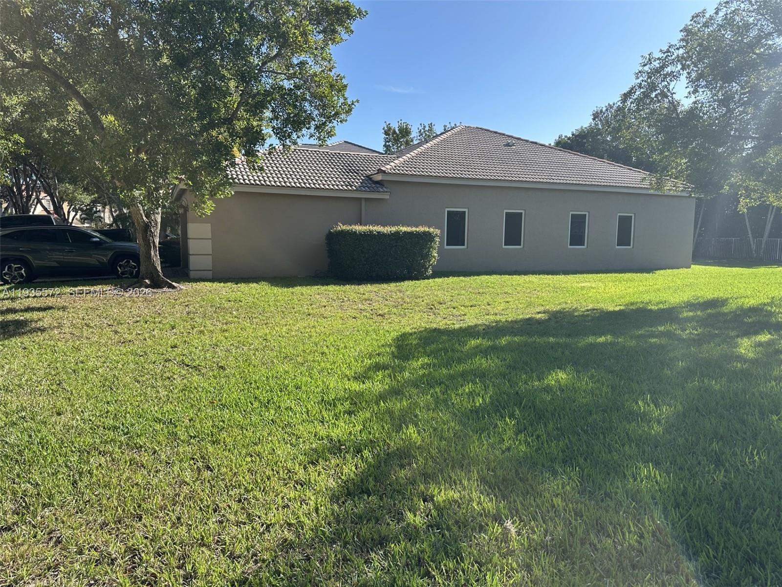 The Ridges Weston, FL 33331 - Photo 27 of 28 a front view of a house with a yard