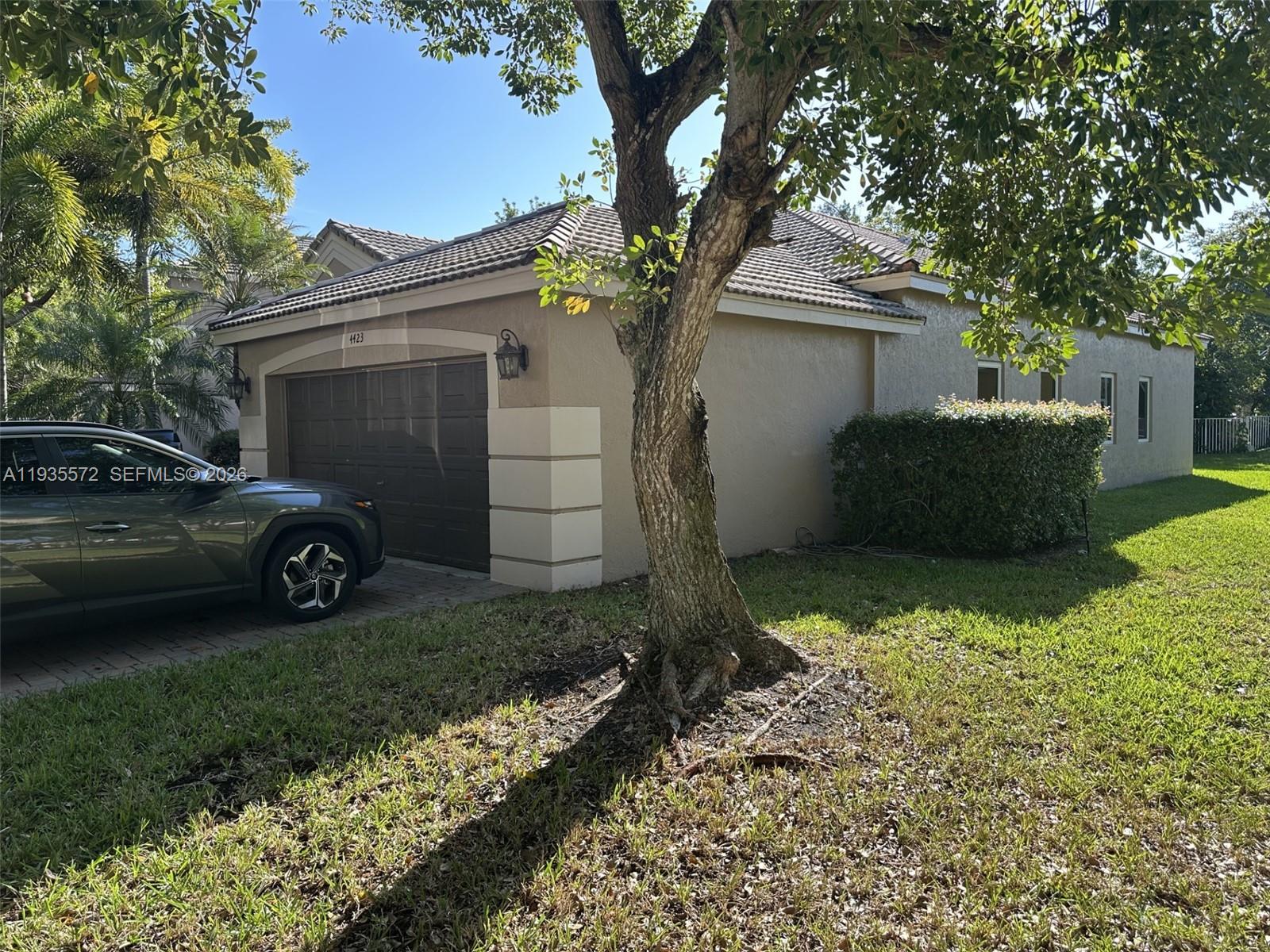 The Ridges Weston, FL 33331 - Photo 3 of 28 a view of a house with a yard and a large tree