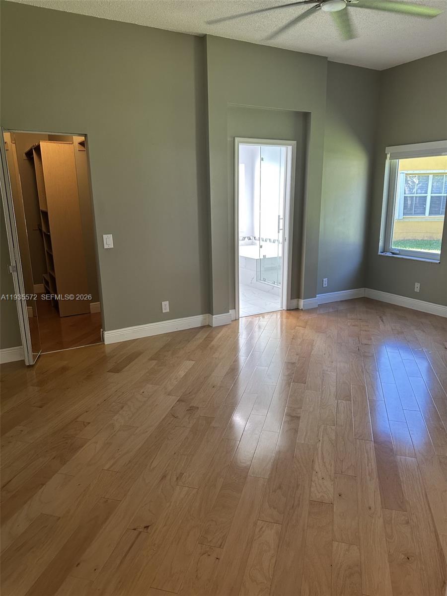 The Ridges Weston, FL 33331 - Photo 10 of 28 a view of a room with wooden floor and windows