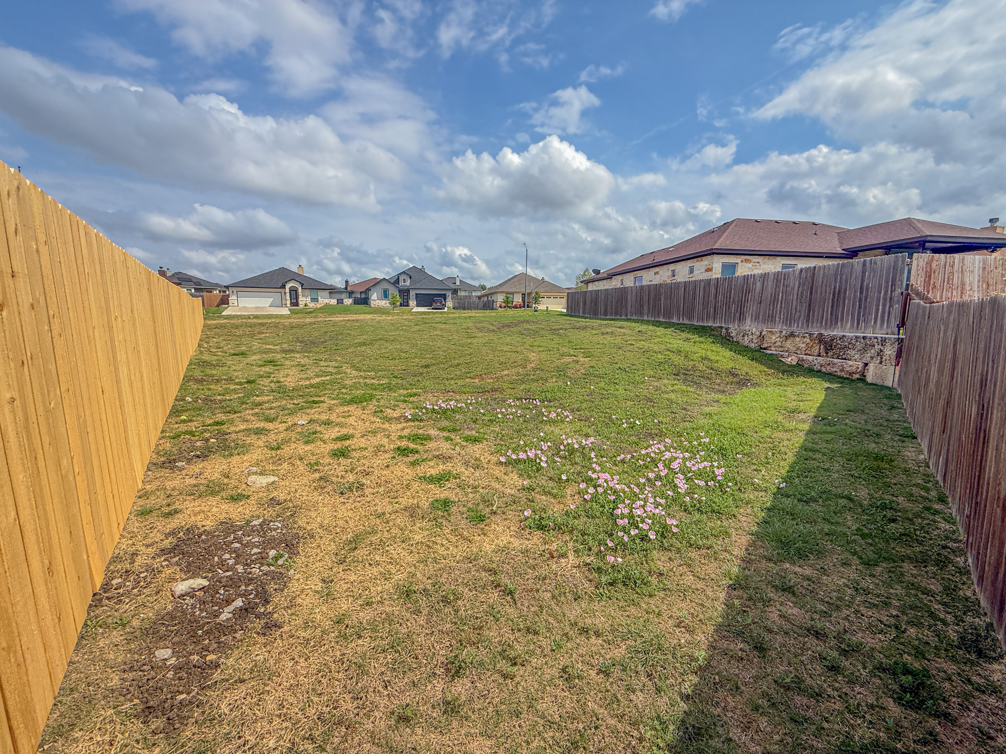 169 Greg Lane Jarrell, TX 76537 - Photo 4 of 5 Fenced backyard featuring a residential view