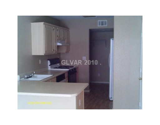 10215 Rising Tree Street Las Vegas, NV 89183 - Photo 4 of 10 Kitchen. NOTE THE EASY CARE FLOOR.