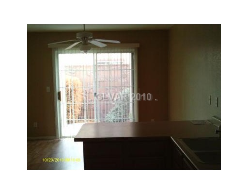 10215 Rising Tree Street Las Vegas, NV 89183 - Photo 5 of 10 Dining Room. VIEW FROM KITCHEN, NOTE THE CEILING FAN!