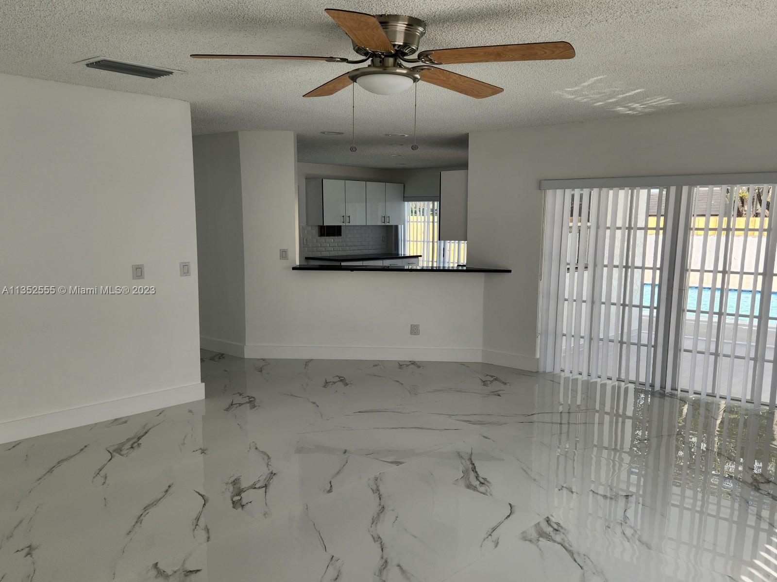 11111 Southwest 147th Court Miami, FL 33196 - Photo 19 of 20 a view of a kitchen with a sink and dishwasher cabinet