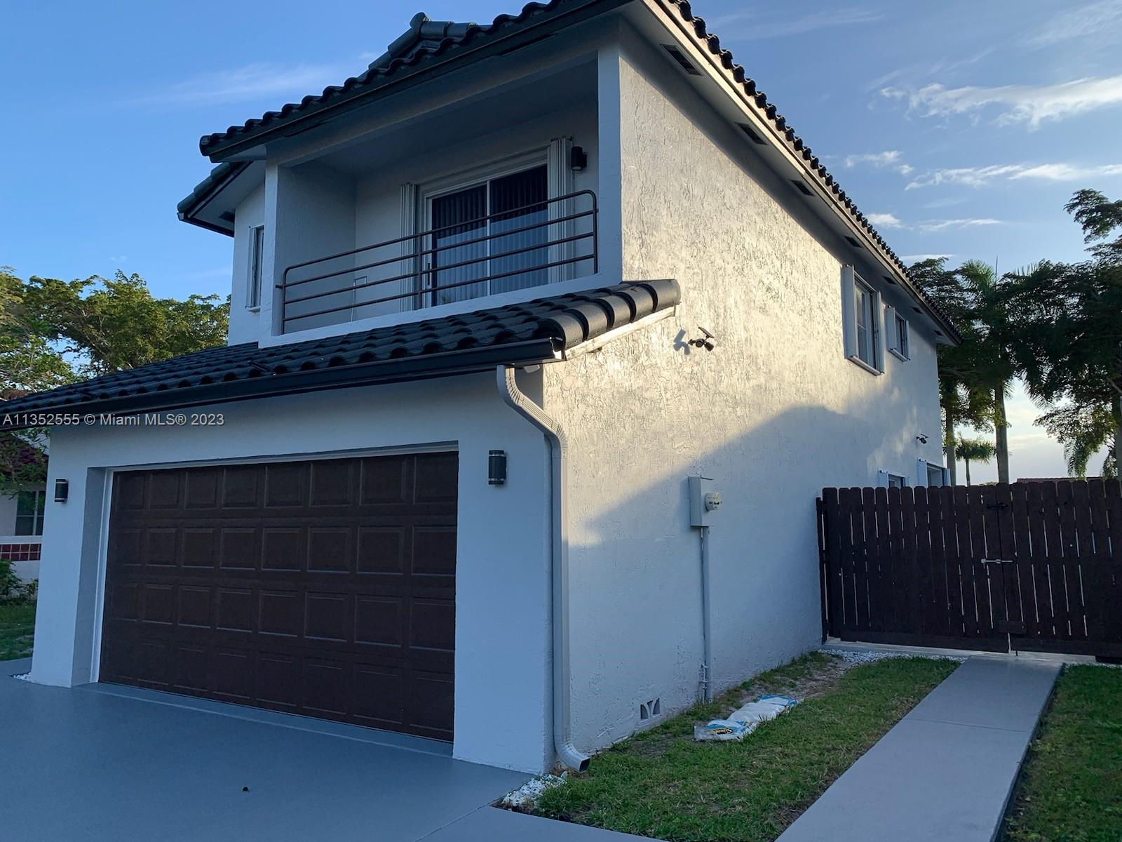 11111 Southwest 147th Court Miami, FL 33196 - Photo 3 of 20 a view of a house with a garage