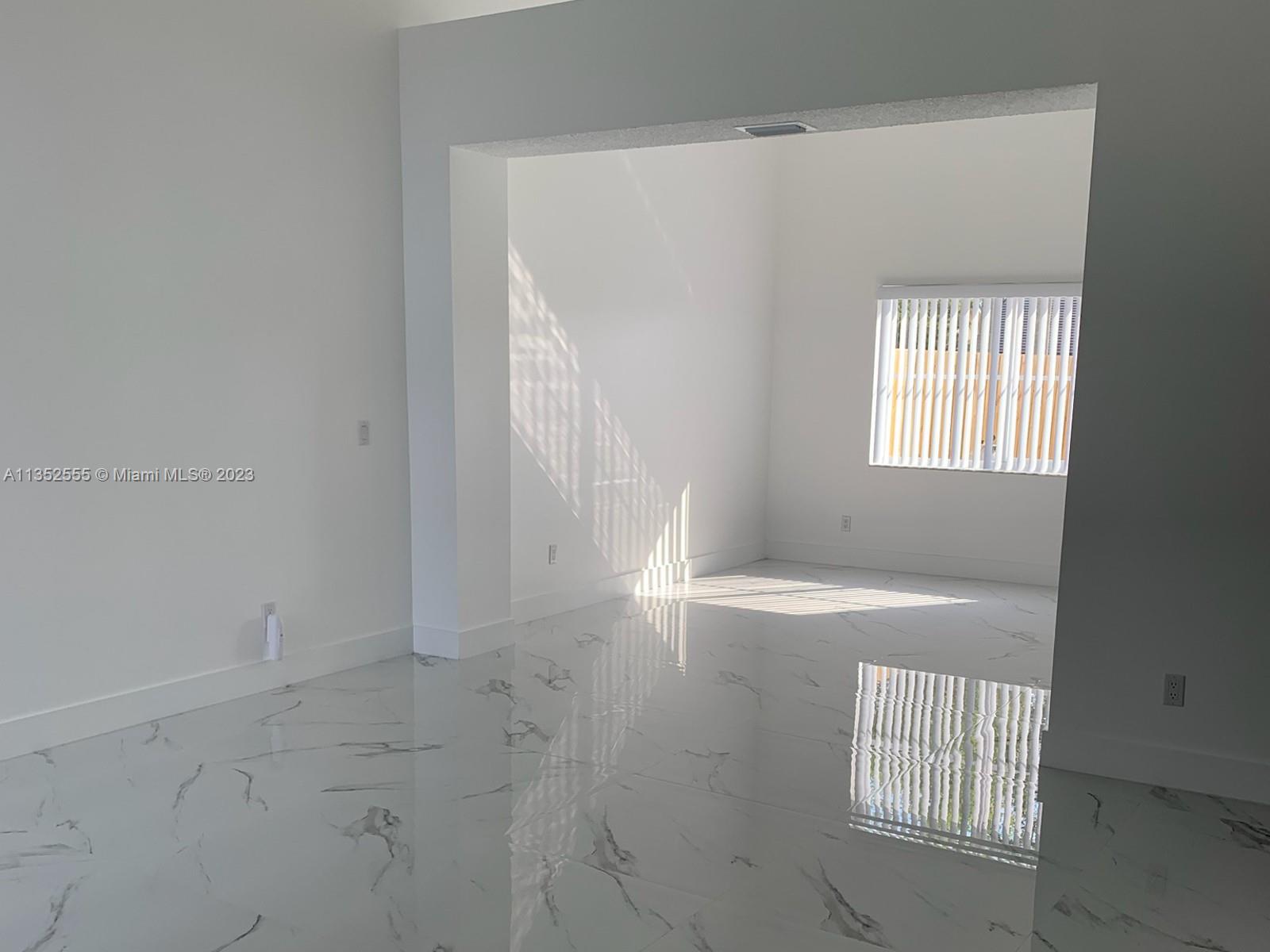 11111 Southwest 147th Court Miami, FL 33196 - Photo 7 of 20 an empty room with windows
