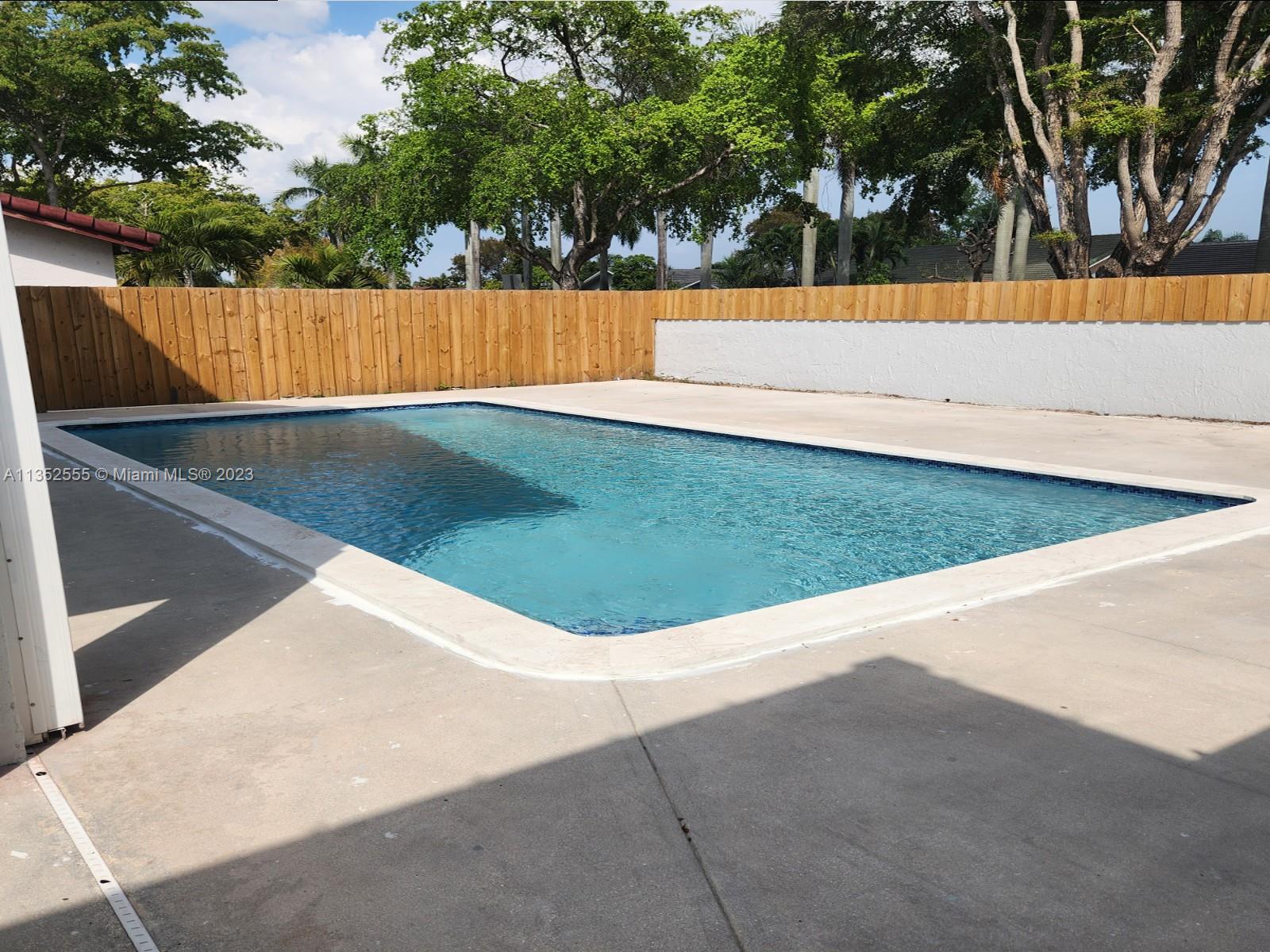 11111 Southwest 147th Court Miami, FL 33196 - Photo 8 of 20 a view of yard with swimming pool and trees
