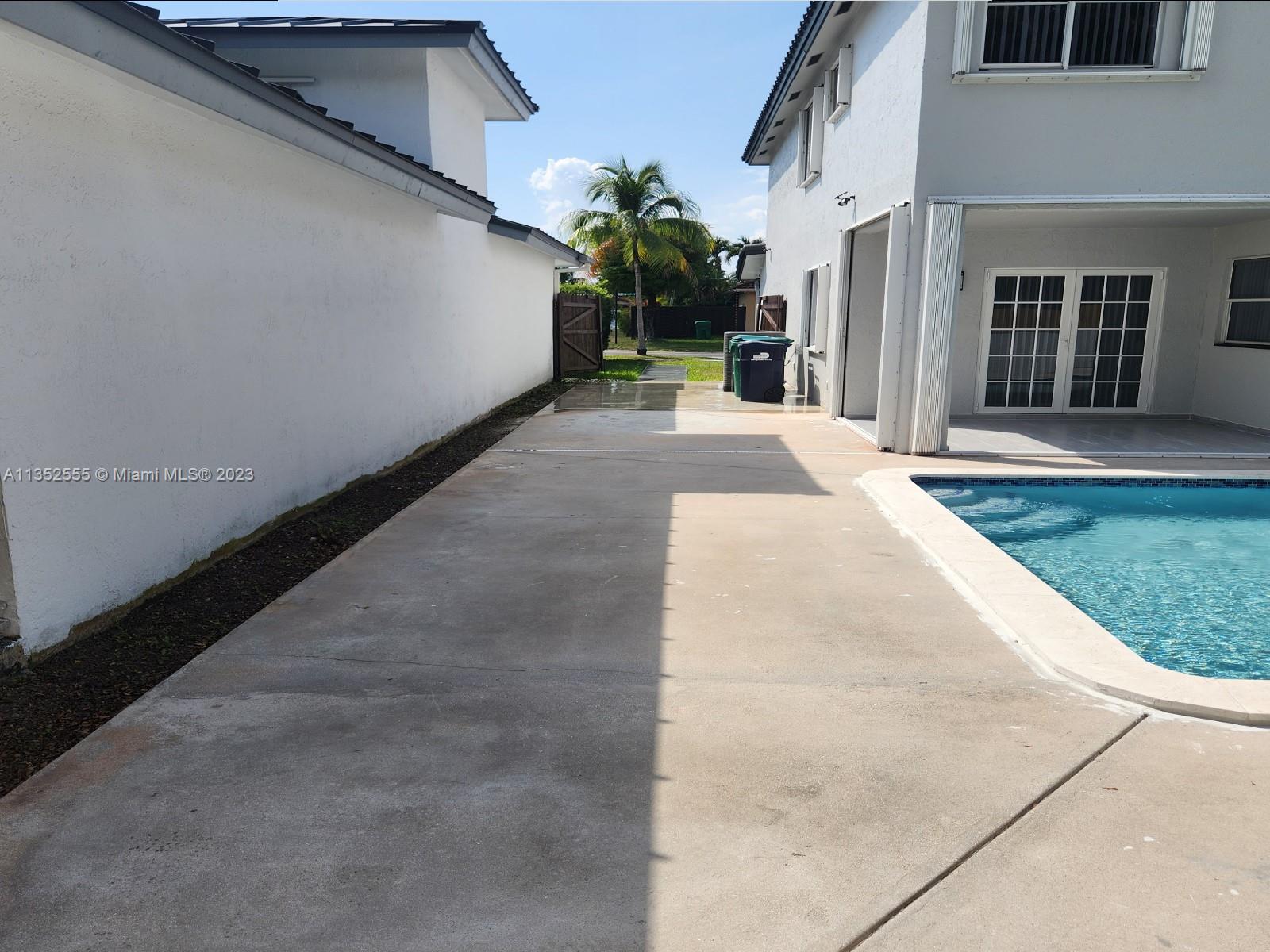 11111 Southwest 147th Court Miami, FL 33196 - Photo 9 of 20 a view of a house with a potted plant