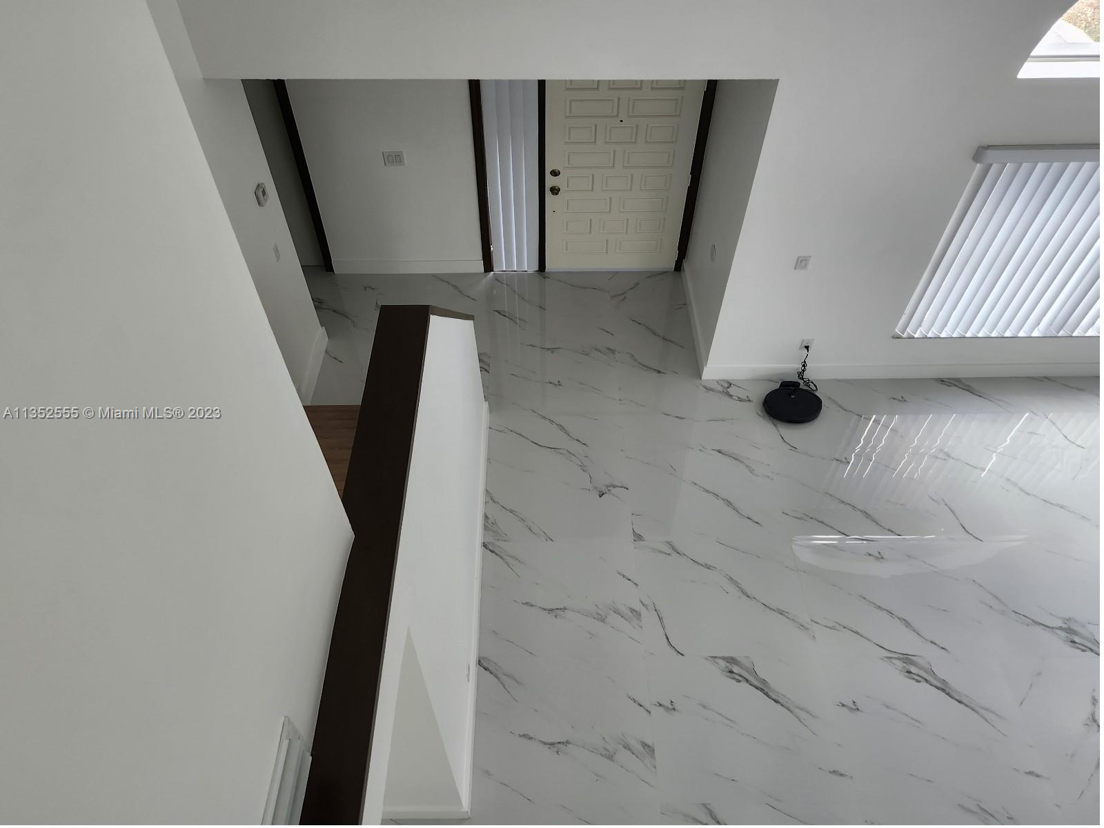 11111 Southwest 147th Court Miami, FL 33196 - Photo 10 of 20 a view of stairs and utility room
