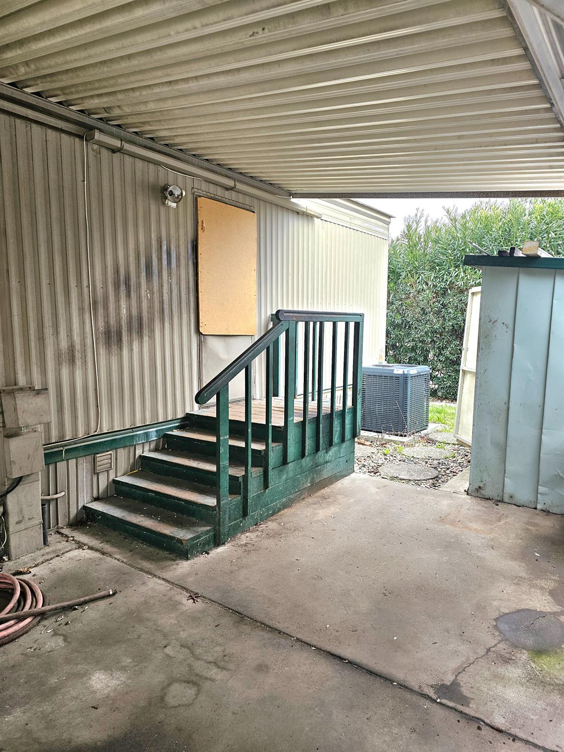 8665 Florin Road, Unit 109 Sacramento, CA 95828 - Photo 6 of 18 a view of a porch with wooden floor and stairs