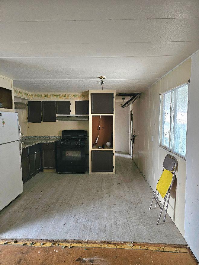 8665 Florin Road, Unit 109 Sacramento, CA 95828 - Photo 9 of 18 a living room with furniture and a flat screen tv