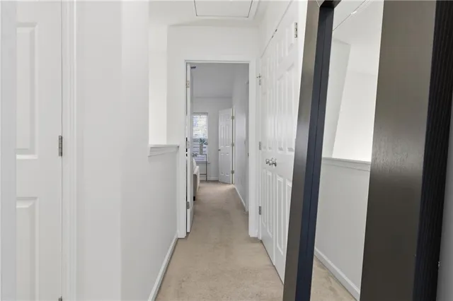 a view of a bathroom from a hallway