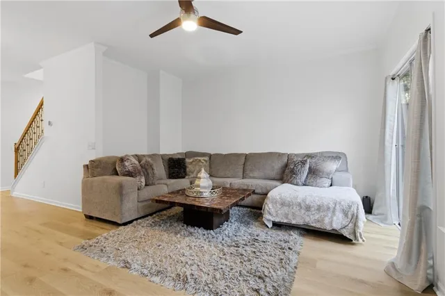 a living room with furniture and a lamp