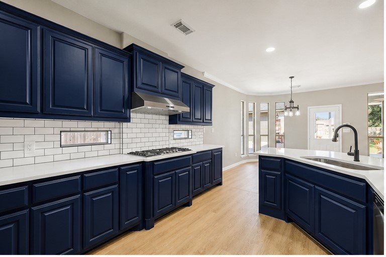 7324 Moon Rock Road Austin, TX 78739 - Photo 7 of 30 a kitchen with lots of counter top space sink and cabinets