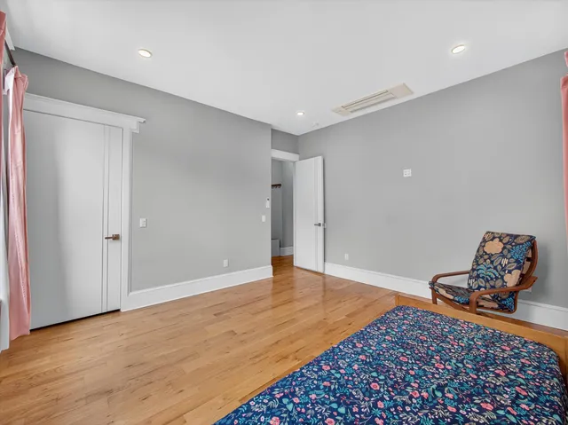 a view of workspace room with wooden floor