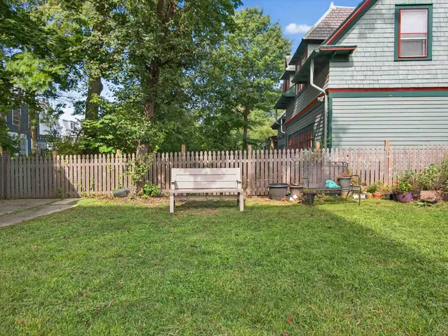 a view of backyard with a garden and deck