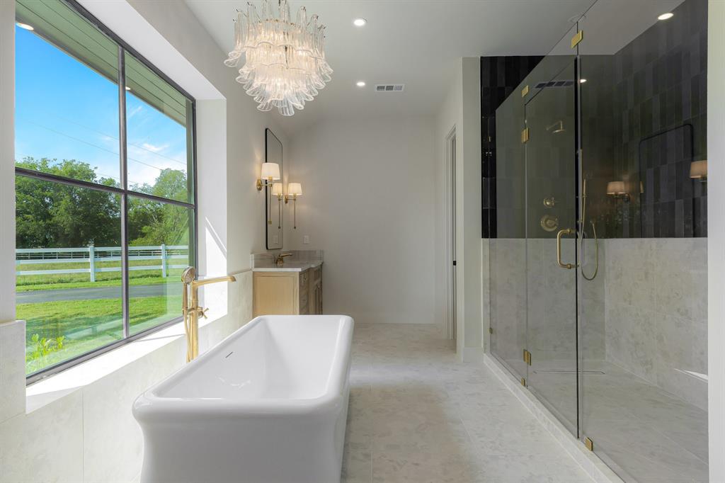 1040 Brush Creek Road Argyle, TX 76226 - Photo 19 of 40 a bathroom with a shower and a sink