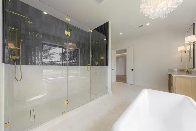 a bathroom with a shower and a sink