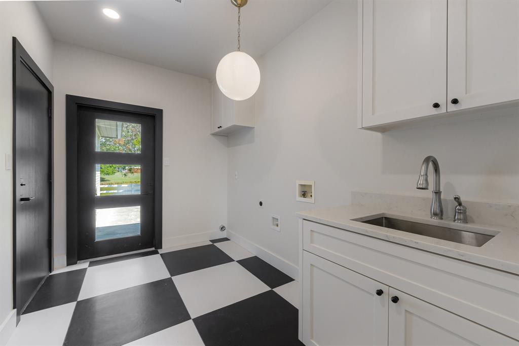1040 Brush Creek Road Argyle, TX 76226 - Photo 24 of 40 a kitchen with a sink and cabinets