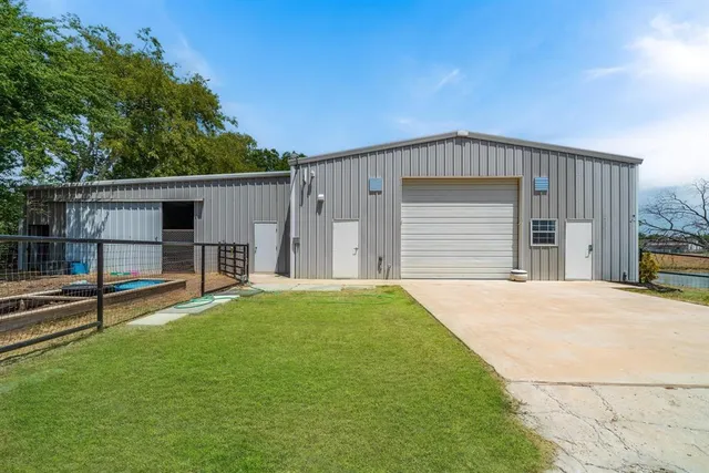 a view of a lake with a table and chairs