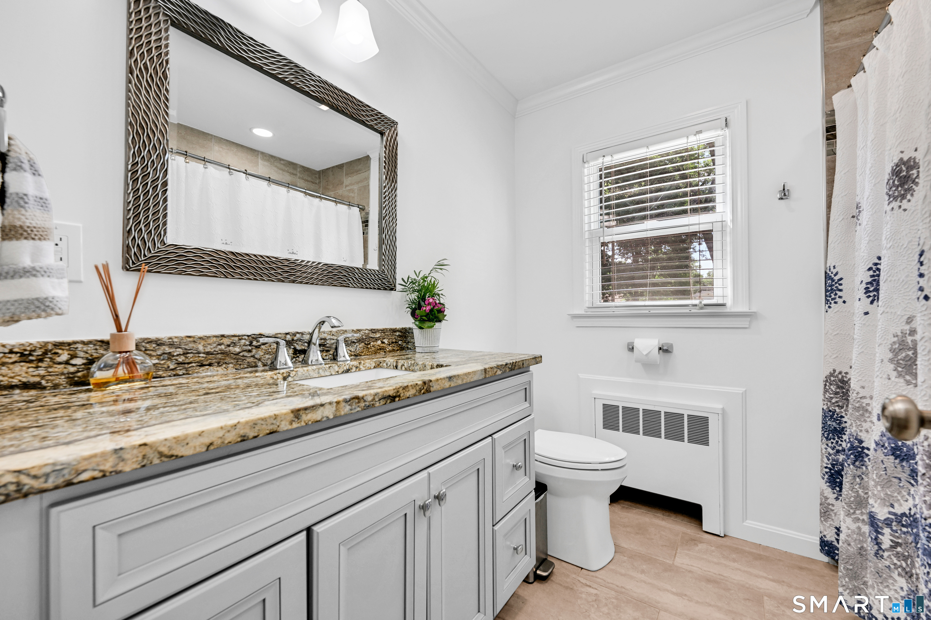 87 Lydall Road Newington, CT 06111 - Photo 21 of 35 a bathroom with a granite countertop toilet sink and mirror