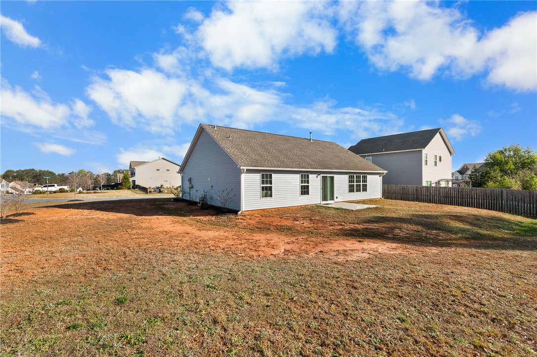 114 Sunny Pt Loop Central, SC 29630 - Photo 18 of 25 This residence features a spacious yard, offering ample space for outdoor living and entertaining.