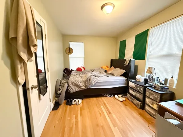 a bed room with a bed and a window