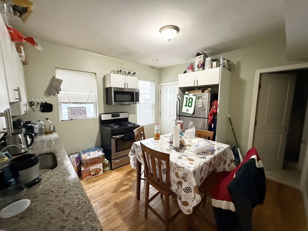 3977 Washington Street, Unit 1 Boston, MA 02131 - Photo 3 of 13 a view of a dining room with furniture