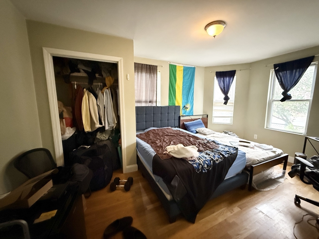 3977 Washington Street, Unit 1 Boston, MA 02131 - Photo 6 of 13 a bedroom with a bed and a window