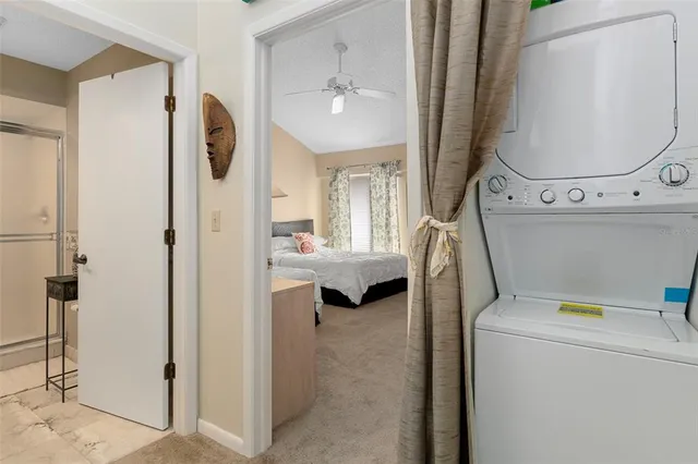 a bedroom with two beds and a chair