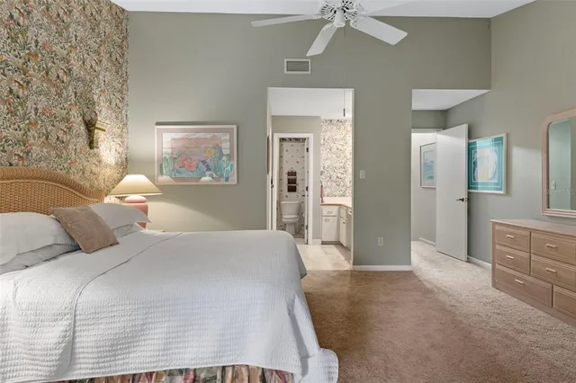 a spacious bathroom with a sink a mirror and shower