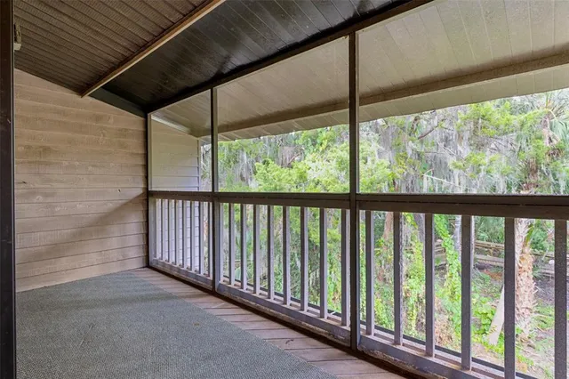 a bedroom with a bed and a glass door