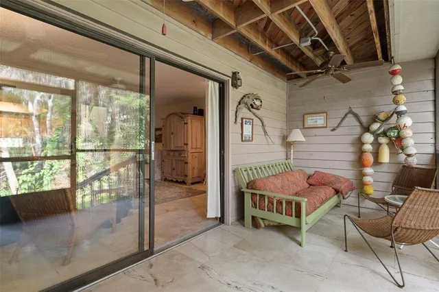 a balcony with wooden floor and fence