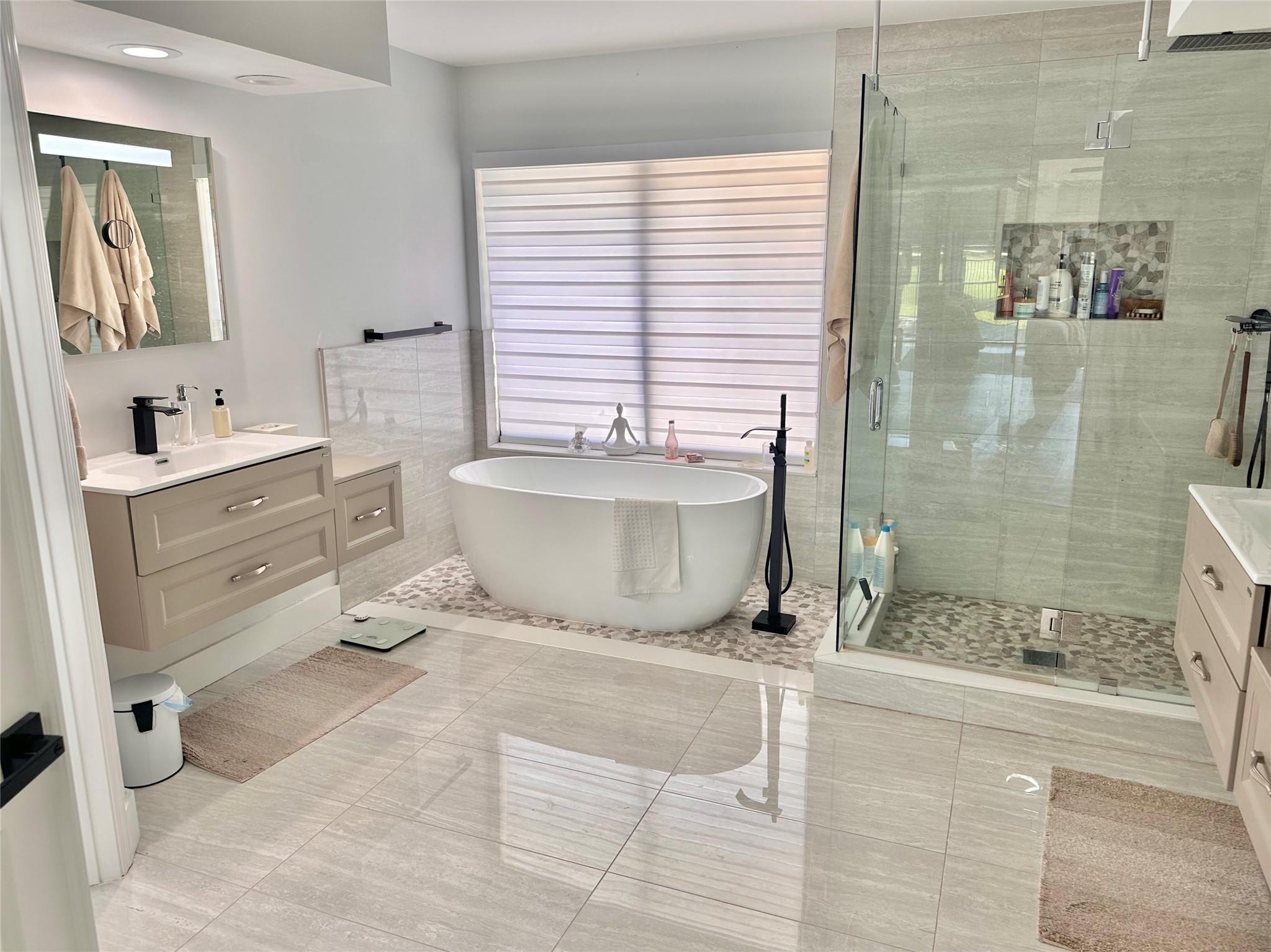 11392 Boca Woods Lane Boca Raton, FL 33428 - Photo 14 of 26 a bathroom with a granite countertop sink toilet a mirror and shower