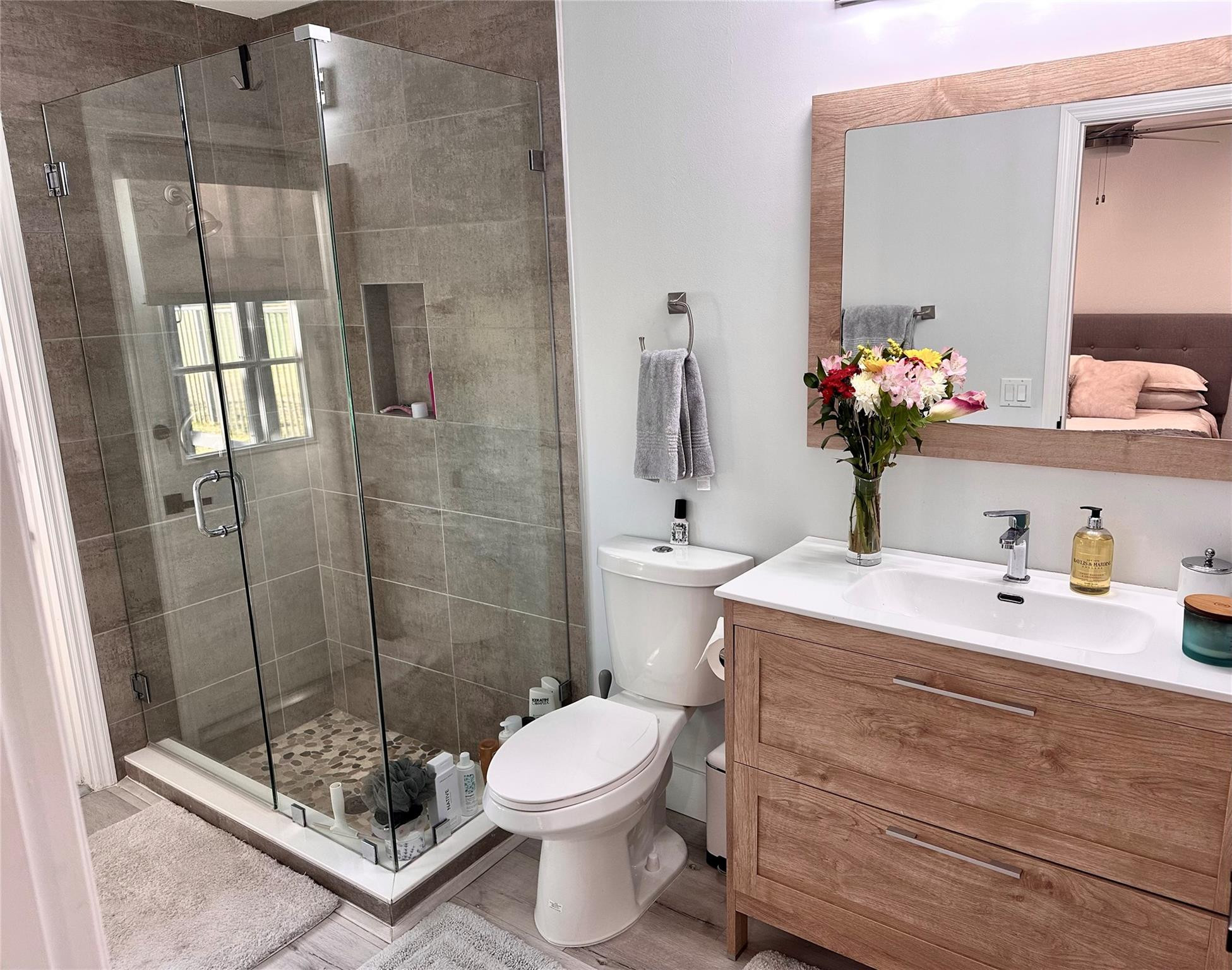 11392 Boca Woods Lane Boca Raton, FL 33428 - Photo 20 of 26 a bathroom with a sink a toilet and shower
