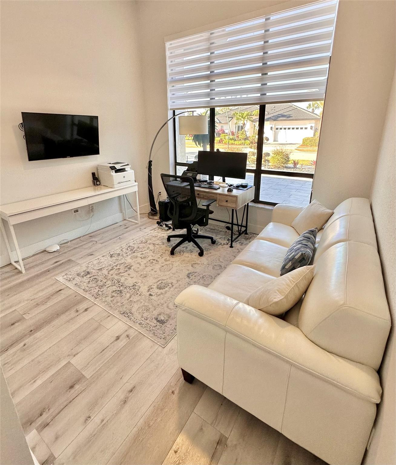 11392 Boca Woods Lane Boca Raton, FL 33428 - Photo 21 of 26 a living room with furniture and a flat screen tv